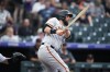 San Francisco Giants' Brandon Belt breaks his bat while grounding out against Colorado Rockies starting pitcher Jose Urena to end the top of the first inning of a baseball game Friday, Aug. 19, 2022, in Denver. Infielder Brandon Belt is leaving the only franchise he's known in his 12-year big-league career - the San Francisco Giants - to sign a one-year deal with the Toronto Blue Jays. THE CANADIAN PRESS/AP-David Zalubowski