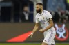 Real Madrid's Karim Benzema reacts after he scored during penalty shootout during a semi-final of the Spanish Super Cup between Real Madrid and Valencia in Riyadh, Saudi Arabia, Wednesday, Jan. 11, 2023. (AP Photo/Hussein Malla)