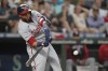 FILE - Washington Nationals' Nelson Cruz swings at a pitch during the team's baseball game against the Seattle Mariners, Aug. 23, 2022 in Seattle. Cruz has agreed to a $1 million, one-year contract with the San Diego Padres, according to two people with knowledge of the deal. The people spoke with The Associated Press on condition of anonymity Wednesday, Jan. 11, because the contract is pending a physical and had not been completed. (AP Photo/Ted S. Warren, File)