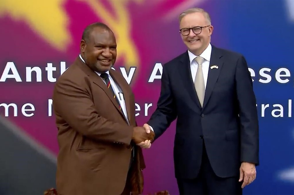 In this image from a video, Australian Prime Minister Anthony Albanese, left, and Papua New Guinea's Prime Minister James Marape shake hands outside the parliament in Port Moresby, Papua New Guinea Thursday, Jan. 12, 2023. The leaders of Australia and neighboring Papua New Guinea said Thursday they are finalizing a new security treaty, a move that comes as a challenge to China's growing assertiveness in the region. (Australia Pool via AP)