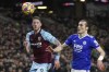 FILE - Leicester's Caglar Soyuncu, right and Burnley's Wout Weghorst challenge for the ball during the English Premier League soccer match between Burnley and Leicester City at Turf Moor stadium in Burnley, England, on March 1, 2022. Manchester United has moved to help fill the void left by Cristiano Ronaldo by signing Wout Weghorst on loan from Burnley until the end of the season. (AP Photo/Jon Super, File)