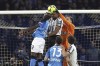 Napoli's Victor Osimhen, left, jumps for the ball with Juventus' Bremer, centre, and Juventus goalkeeper Wojciech Szczesny during the Serie A soccer match between SSC Napoli and Juventus FC at the Diego Armando Maradona stadium in Naples, Italy, Friday, Jan. 13, 2023. (Alessandro Garofalo/LaPresse via AP)