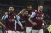 Aston Villa players celebrate after Aston Villa's Emiliano Buendia scored his sides second goal after a VAR review during the English Premier League soccer match between Aston Villa and Leeds United at Villa Park in Birmingham, England, Friday, Jan. 13, 2023. (AP Photo/Rui Vieira)
