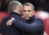 Leicester City manager Brendan Rodgers, right, greets Nottingham Forest manager Steve Cooper ahead of the English Premier League soccer match between Leicester City and Nottingham Forest at the City Ground in Nottingham, England, Saturday Jan. 14, 2023. (Mike Egerton/PA via AP)