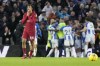 Liverpool's Trent Alexander-Arnold, left, reacts after Brighton's Solly March scored his side's second goal during the English Premier League soccer match between Brighton and Liverpool at the Falmer Stadium in Brighton, England, Saturday, Jan. 14, 2023. (AP Photo/Frank Augstein)