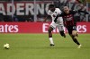 Milan's Sergino Dest, right, and Torino's Stephane Singo fight for the ball during the round of 16 Italian Cup soccer match between AC Milan and Torino FC, at San Siro Stadium in Milan, Italy, Wednesday, Jan. 11, 2023. (Marco Alpozzi/LaPresse via AP)