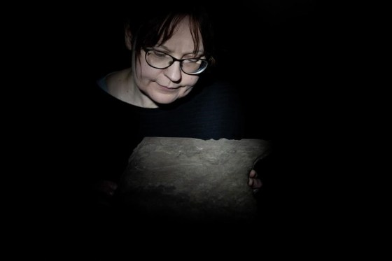 Kristel Zilmer, professor of written culture and iconography at the Museum of Cultural History, displays a runestone found at Tyrifjorden, Norway. (Javad Parsa / NTB Scanpix / The Associated Press files)
