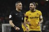 Wolverhampton Wanderers' Ruben Neves, right, reacts to a decision by referee Andre Marriner during the English FA Cup 3rd round replay soccer match between Wolverhampton Wanderers and Liverpool at Molineux stadium in Wolverhampton, England, Tuesday Jan. 17, 2023. (AP Photo/Rui Vieira)