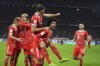FILE - Bayern's Leon Goretzka, centre top, and Serge Gnabry, centre, celebrate with teammates after scoring their side's third goal during the Bundesliga soccer match between Bayern Munich and Werder Bremen at the Allianz Arena in Munich, on Nov. 8, 2022. Bayern Munich faces Leipzig on Friday Jan. 20, 2023 in a game which will shape the title race, and bring the competition back to life after more than two months without any top-division games. (AP Photo/Matthias Schrader, File)