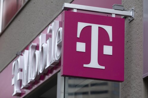 FILE - The T-Mobile logo is seen on a storefront, Oct. 14, 2022, in Boston. The U.S. wireless carrier T-Mobile said Thursday, Jan. 19, 2023, that an unidentified malicious intruder breached its network in late November and stole data on 37 million customers, including addresses, phone numbers and dates of birth. (AP Photo/Michael Dwyer, File)