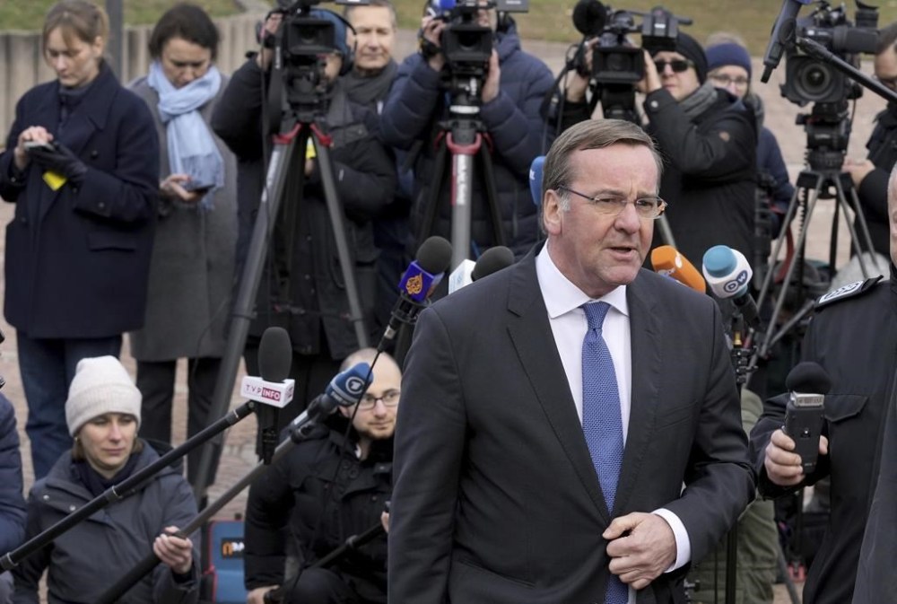 German Defence Minister Boris Pistorius, front, leaves after a press conference during the meeting of the 'Ukraine Defense Contact Group' at Ramstein Air Base in Ramstein, Germany, Friday, Jan. 20, 2023. Defense leaders are gathering at Ramstein Air Base in Germany Friday to hammer out future military aid to Ukraine, amid ongoing dissent over who will provide the battle tanks that Ukrainian leaders say they desperately need. (AP Photo/Michael Probst)