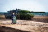 FILE - German Chancellor Olaf Scholz speaks to soldiers in front of a Leopard 2 main battle tank after the Army's training and instruction exercise in Ostenholz, Germany, Monday, oct. 17, 2022. Germany has become one of Ukraine's leading weapons suppliers in the 11 months since Russia's invasion. The debate among allies about the merits of sending battle tanks to Ukraine has focused the spotlight relentlessly on Germany, whose Leopard 2 tank is used by many other countries and has long been sought by Kyiv. (Moritz Frankenberg/dpa via AP, FILE)