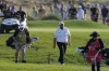 Shane Lowry of Ireland walks on the 18th fairway during the third round of Abu Dhabi HSBC Golf Championship, in Abu Dhabi, United Arab Emirates, Saturday, Jan. 21, 2023. (AP Photo/Kamran Jebreili)