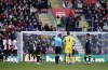 Referee Michael Salisbury speaks to Aston Villa goalkeeper Emiliano Martinez as he leads the players off the pitch after a drone flying over the stadium stops playduring the English Premier League soccer match between Southampton and Aston Villa at St. Mary's Stadium, in Southampton, England, Saturday, Jan. 21, 2023. (Andrew Matthews/PA via AP)