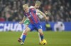 Crystal Palace's Will Hughes is challenged by Newcastle's goalkeeper Mark Gillespie, rear, during the English Premier League soccer match between Crystal Palace and Newcastle at the Selhurst Park Stadium in London, Saturday, Jan. 21, 2023. (AP Photo/Kirsty Wigglesworth)