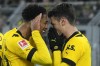 Dortmund's Jude Bellingham, left, celebrates with Dortmund's Giovanni Reyna, right, who scored his side's fourth goal during the German Bundesliga soccer match between Borussia Dortmund and FC Augsburg in Dortmund, Germany, Sunday, Jan. 22, 2023. (AP Photo/Martin Meissner)