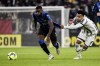 Atalanta's Jeremie Boga, left, and Juventus' Weston McKennie battle for the ball during the Serie A soccer match between Juventus and Atalanta at Juventus Stadium in Turin, Italy, Sunday Jan. 22, 2023. (Marco Alpozzi/LaPresse via AP)