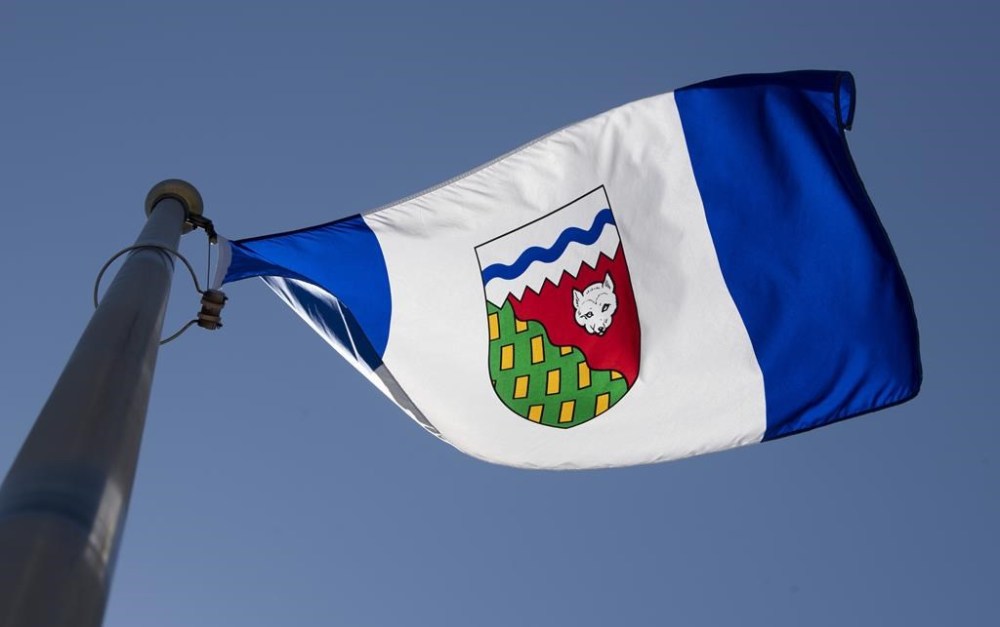The Northwest Territories is considering whether to end seasonal time changes after a survey suggested there's interest in the move. The Northwest Territories flag flies on a flag pole in Ottawa, Monday July 6, 2020. THE CANADIAN PRESS/Adrian Wyld