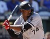 FILE - Chicago White Sox's Eloy Jimenez prepares to hit during a baseball game against the Kansas City Royals in Kansas City, Mo., Aug. 11, 2022. It looks as if Jimenez could spend a lot of time at designated hitter this year but he has other plans. (AP Photo/Colin E. Braley, File)