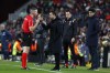 Referee Javier Iglesias Villanueva, left, speaks with Barcelona's head coach Xavi Hernandez during a Spanish La Liga soccer match between Barcelona and Getafe at the Camp Nou stadium in Barcelona, Spain, Sunday, Jan. 22, 2023. (AP Photo/Joan Monfort)