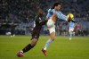 AC Milan's Pierre Kalulu, left, defends against Lazio's Felipe Anderson during the Italian Serie A soccer match between Lazio and AC Milan at the Olympic Stadium in Rome, Tuesday, Jan. 24, 2023. (AP Photo/Gregorio Borgia)