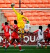 Canada goalkeeper Erin McLeod (1) reaches for the ball during the first half of a CONCACAF Olympic qualifying tournament soccer match against Trinidad & Tobago Sunday, Feb. 14, 2016, in Houston. Canada won 6-0.  McLeod and her wife, Iceland international midfielder Gunny Jonsdottir, are leaving the NWSL's Orlando Pride to play in Iceland. THE CANADIAN PRESS/AP-David J. Phillip