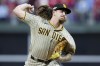 FILE -San Diego Padres starting pitcher Mike Clevinger throws during the first inning in Game 4 of the baseball NL Championship Series between the San Diego Padres and the Philadelphia Phillies on Oct. 22, 2022, in Philadelphia. Chicago White Sox pitcher Mike Clevinger is being investigated by Major League Baseball following an allegation of domestic violence, Tuesday, Jan. 24, 2023.(AP Photo/Matt Slocum, File)