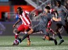 Forge FC's Alessandro Hojabrpour (21) battles for possession with Atletico Ottawa's Ballou Tabla (13) during second half Canadian Premier League finals soccer action in Ottawa on October 30, 2022. THE CANADIAN PRESS/Justin Tang