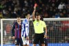 Referee gives a red card to Real Sociedad's Brais Mendez during the Spanish Copa del Rey soccer match between Barcelona and Real Sociedad at the Camp Nou stadium, in Barcelona, Spain, Wednesday, Jan. 25, 2023. (AP Photo/Joan Monfort)