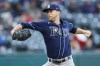 FILE -Tampa Bay Rays starting pitcher Jeffrey Springs delivers against the Cleveland Guardians during the first inning of a baseball game Thursday, Sept. 29, 2022, in Cleveland. Left-hander Jeffrey Springs became the first of the 33 players who exchanged proposed arbitration salaries with their teams to reach a deal, agreeing Wednesday, Jan. 25, 2023 to a $31 million, four-year contract with the Tampa Bay Rays that could be worth $65.75 million over five seasons.(AP Photo/Ron Schwane, File)