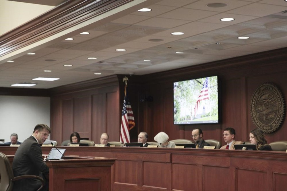 Treniss Evans III, who pleaded guilty to federal trespassing charges in relation to the Jan. 6, 2021, siege on the U.S. Capitol, speaks Wednesday, Jan. 25, 2023, before the South Dakota House State Affairs Committee in Pierre, S.D. (AP Photo/Amancai Biraben)