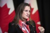 Minister of Finance and Deputy Prime Minister Chrystia Freeland speaks to the media at the Hamilton Convention Centre, in Hamilton, Ont., on Tuesday, January 24, 2023. The federal government failed to spend tens of billions of dollars in the last fiscal year on promised programs and services, including new military equipment, affordable housing and support for veterans. THE CANADIAN PRESS/Nick Iwanyshyn