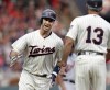 FILE - Minnesota Twins' Joe Mauer celebrates his home run with Twins' third base coach Gene Glynn against the Detroit Tigers in the first inning during a baseball game Saturday, Aug. 18, 2018, in Minneapolis. Joe Mauer will be the next addition to the Minnesota Twins Hall of Fame. Mauer will become the 38th member of the group when he’s inducted on Aug. 5, 2023 before the Twins host Arizona. (AP Photo/Andy Clayton-King, File)