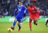 Leicester's Jamie Vardy, left, and Brighton's Moises Caicedo battle for the ball during the English Premier League soccer match between Leicester City and Brighton & Hove Albion at the King Power Stadium, Leicester, England, Saturday, Jan. 21, 2022. (Mike Egerton/PA via AP)