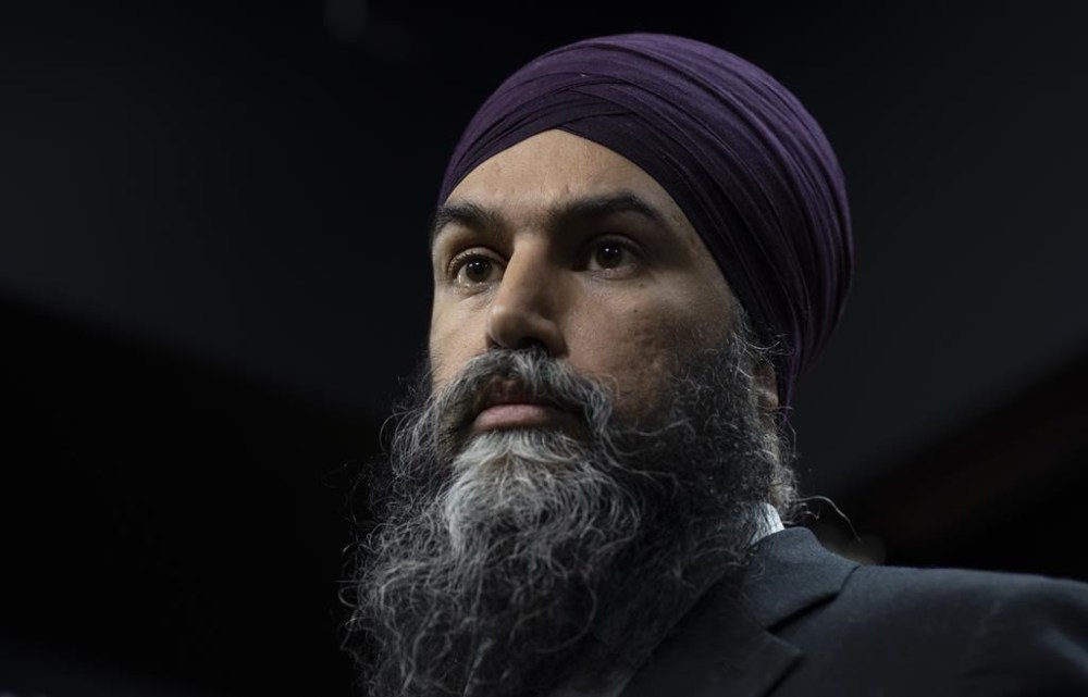 New Democratic Party leader Jagmeet Singh listens to a question during an availability on Parliament Hill, Thursday, January 19, 2023 in Ottawa. Singh says he will call on the House of a Commons to hold an emergency debate on the privatization of health care. THE CANADIAN PRESS/Adrian Wyld