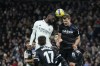 Real Madrid's Antonio Rudiger, left, and Real Sociedad's Alexander Sorloth fight for the ball during the Spanish La Liga soccer match between Real Madrid and Real Sociedad, at the Santiago Bernabeu stadium in Madrid, Sunday, Jan. 29, 2023. (AP Photo/Manu Fernandez)