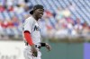 Miami Marlins second baseman Jazz Chisholm Jr. smiles during a baseball game against the Philadelphia Phillies, June 13, 2022, in Philadelphia. Chisholm Jr. has been revealed as the cover athlete for Sony’s MLB The Show 2023 video game. (AP Photo/Laurence Kesterson)
