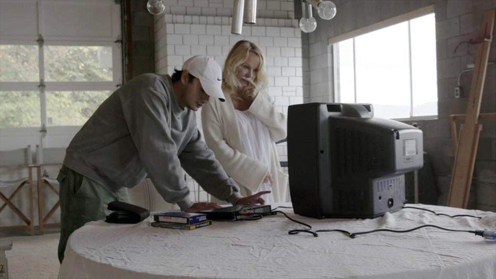 This image released by Netflix shows Pamela Anderson, right, and her son Brandon Thomas Lee in a scene from the documentary