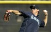 FILE - Seattle Mariners outfielder Brad Wilkerson throws the ball during baseball spring training at the team's complex in Peoria, Ariz., Feb. 18, 2008. Former big leaguer Brad Wilkerson was hired as the New York Yankees' assistant hitting coach on Monday, Jan. 30, 2023. (AP Photo/Charlie Riedel, File)