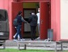 The former Real Madrid soccer player Isco, left, arrives for his medical check at the sports medicine department of the Charite in Berlin, Germany, Tuesday, Jan. 31, 2023. The Spanish soccer player is about to be signed by German Bundesliga club Union Berlin. (Matthias Koch/dpa via AP)