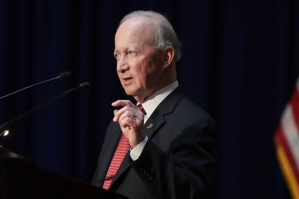 FILE - Former Indiana Gov. Mitch Daniels, president of Purdue University, delivers remarks to hundreds of mourners gathered at a memorial service honoring former U.S. Sen. Birch Bayh at the Indiana Statehouse in Indianapolis, May 1, 2019. Daniels announced Tuesday that he wouldn’t seek that state’s open U.S. Senate seat next year, ending weeks of speculation about whether the longtime Republican figure would enter a possibly vicious GOP primary fight with a combative defender of former President Donald Trump.(AP Photo/Michael Conroy, File)