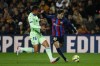 Barcelona's Gavi, right, attempts a shot at goal in front of Getafe's Angel Algobia during a Spanish La Liga soccer match between Barcelona and Getafe at the Camp Nou stadium in Barcelona, Spain, Sunday, Jan. 22, 2023. (AP Photo/Joan Monfort)