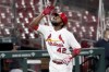 FILE - St. Louis Cardinals' Dexter Fowler celebrates as he rounds the bases after hitting a two-run home run during the second inning of a baseball game against the Cleveland Indians, Aug. 28, 2020, in St. Louis. Fowler says he is retiring at age 36 after 14 major league seasons. (AP Photo/Jeff Roberson, file)