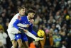 Leeds United's Diego Llorente, left, duels for the ball with Cardiff's Kion Etete during the English FA Cup third round soccer match between Leeds United and Cardiff City at Elland Road Stadium in Leeds, England, Wednesday, Jan. 18, 2023. (AP Photo/Jon Super)