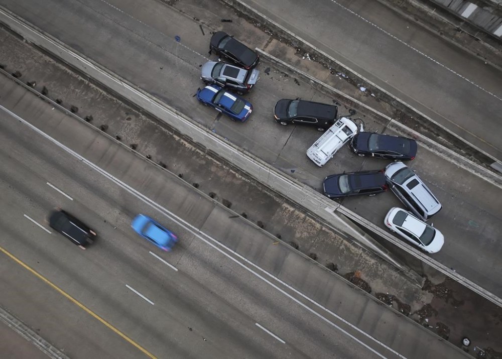A multi-vehicle fatal accident occurred on the Ben White Boulevard on ramp at South First Street, in Austin, Texas, during an ice storm on Tuesday Jan. 31, 2023. Winter weather is bringing ice to a wide swath of the United States, causing the cancellation of more than 1,600 flights nationwide and knocking out power to thousands of Texans. ( Jay Janner /Austin American-Statesman via AP)