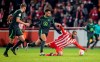 FC Union Berlin's Aissa Laidouni, right, and VfL Wolfsburg's Felix Nmecha fight for the ball during a German Cup soccer match, Tuesday, Jna. 31, 2023, in Berlin. (Andreas Gora/dpa via AP)
