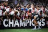 Vancouver Whitecaps' Russell Teibert, centre right, holds the Voyageurs Cup after Vancouver defeated Toronto FC on penalty kicks during the Canadian Championship soccer final, in Vancouver, on Tuesday, July 26, 2022. THE CANADIAN PRESS/Darryl Dyck