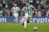 FILE - Argentina's Enzo Fernandez runs with the ball during the World Cup semifinal soccer match between Argentina and Croatia at the Lusail Stadium in Lusail, Qatar, on Dec. 13, 2022. Argentina midfielder Enzo Fernandez became the most expensive player in British soccer history after joining Chelsea from Benfica for 106.7 million pounds ($131.4 million), the Portuguese club announced Wednesday, Feb. 1, 2023. (AP Photo/Frank Augstein, File)