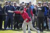 Bobby Bones reacts after a tee shot as Josh Duhamel, left, and Ray Romano, right, look on during the celebrity challenge event of the AT&T Pebble Beach Pro-Am golf tournament in Pebble Beach, Calif., Wednesday, Feb. 1, 2023. (AP Photo/Eric Risberg)