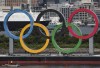 FILE - Workers prepare to remove giant Olympic rings from the waterfront area at Odaiba Marine Park after 2020 Summer Olympics came to an end on Aug. 8 in Tokyo, Japan, Wednesday, Aug. 11, 2021. A Japanese company embroiled in the 2020 Tokyo Olympic corruption scandal said Thursday, Feb. 2, 2023, it would strengthen oversight to prevent further wrongdoing. (Kim Kyung-hoon/Pool Photo via AP, File)